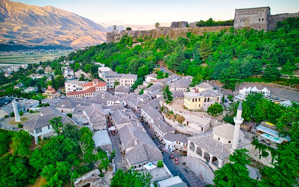 Gjirokaster's historic stone houses and castle in Southern Albania.