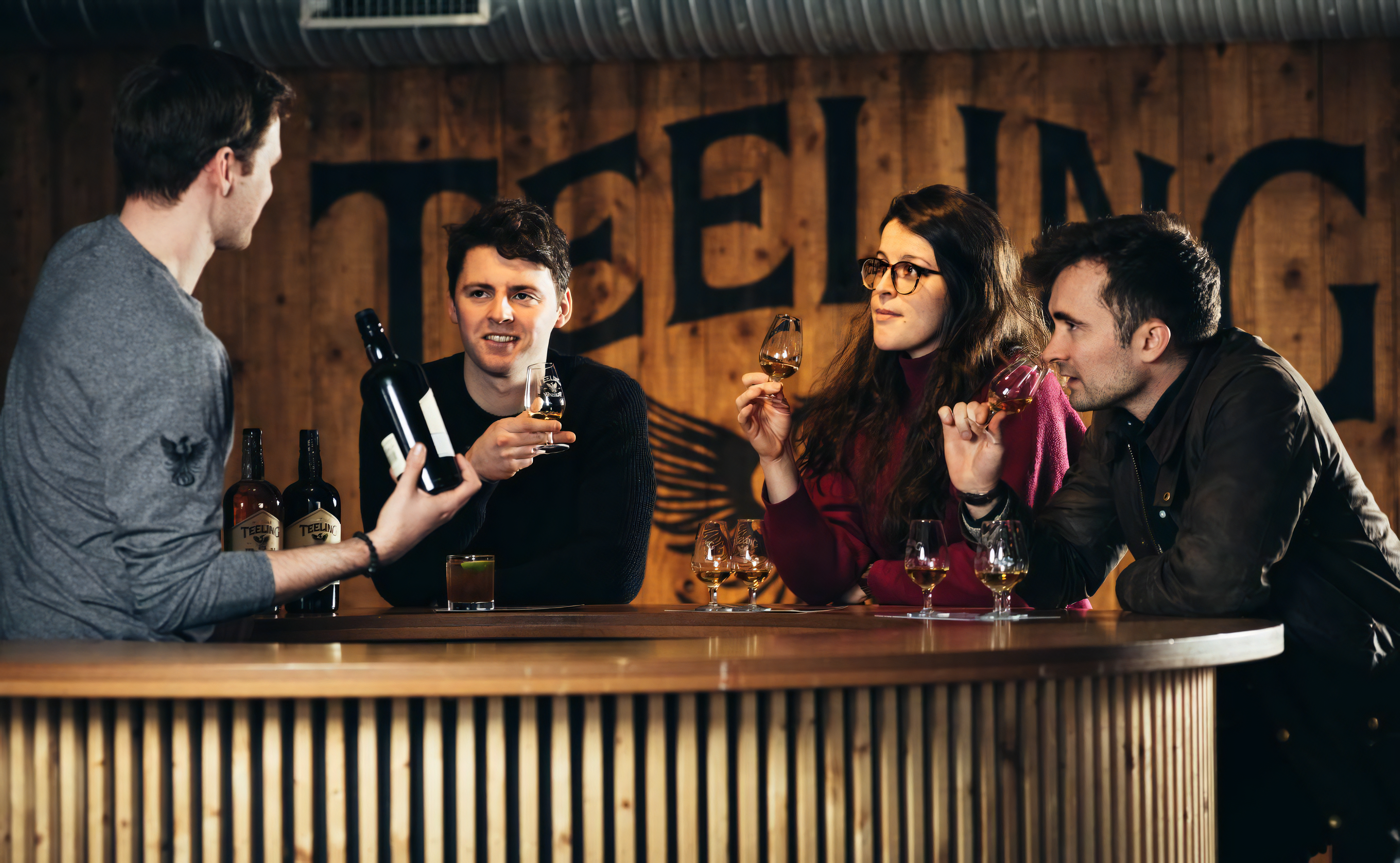 People enjoying whiskey tasting at Teeling Whiskey Distillery.