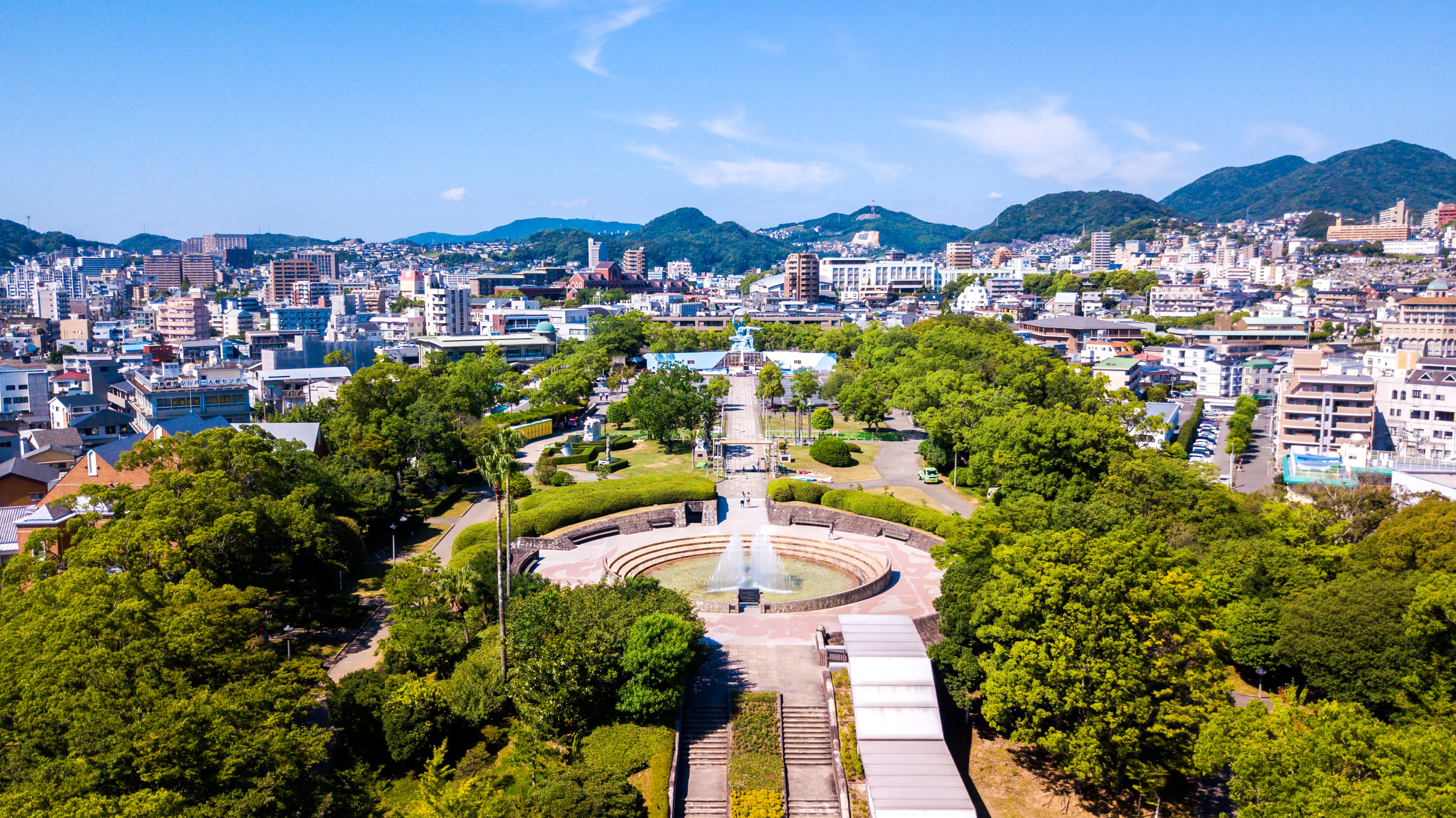 Aerial view of Nagasaki Glover Garden with cityscape and mountains in the background, Fukuoka day tour.