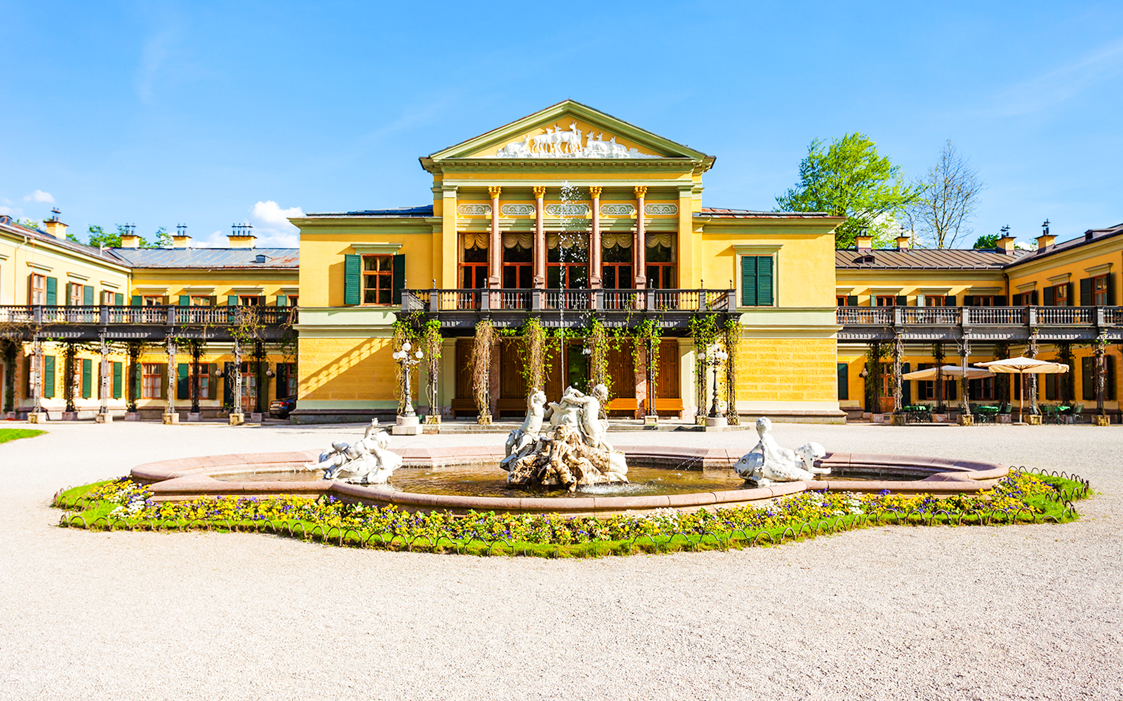 Kaiservilla in Hungary with ornate fountain and gardens in front.