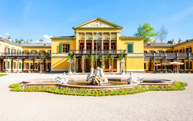 Kaiservilla in Hungary with ornate fountain and gardens in front.