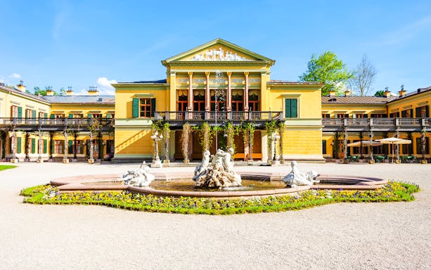 Kaiservilla in Hungary with ornate fountain and gardens in front.