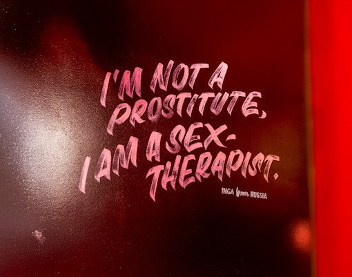 Red Light Secrets Museum interior with vintage furnishings and historical exhibits in Amsterdam.