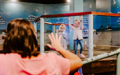 Children interacting with an exhibit at SEA Life Brighton.