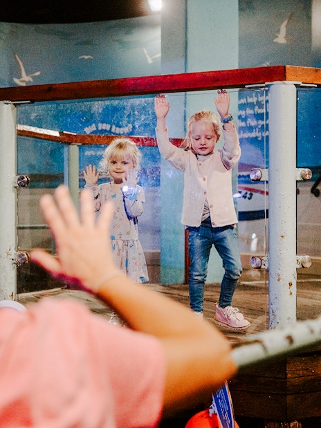 Children interacting with an exhibit at SEA Life Brighton.