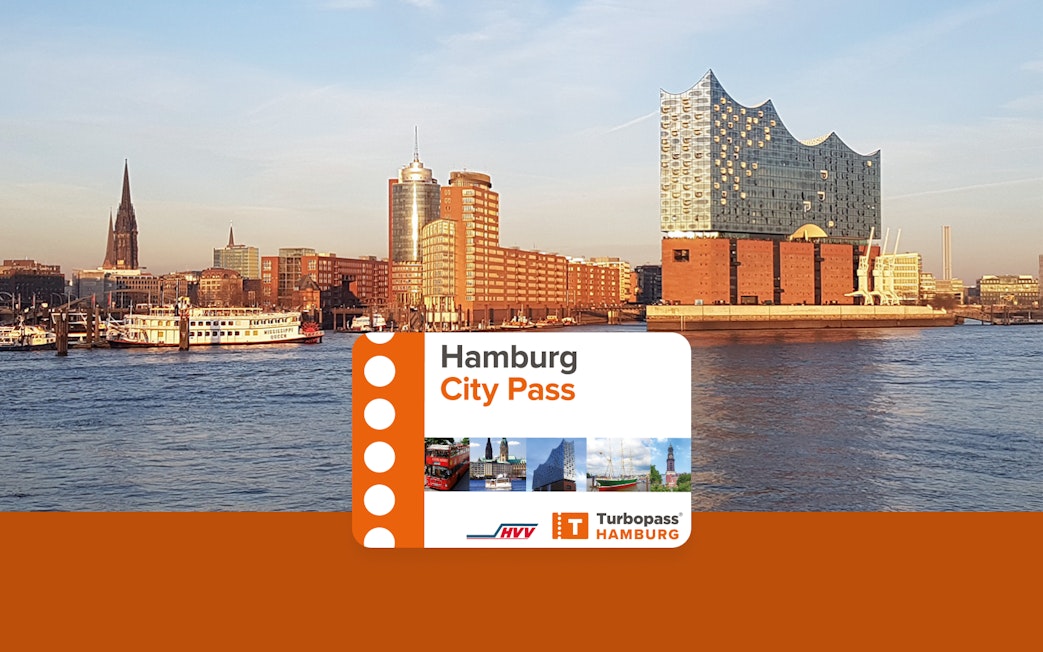 Hamburg skyline with Elbphilharmonie and city pass card in foreground.