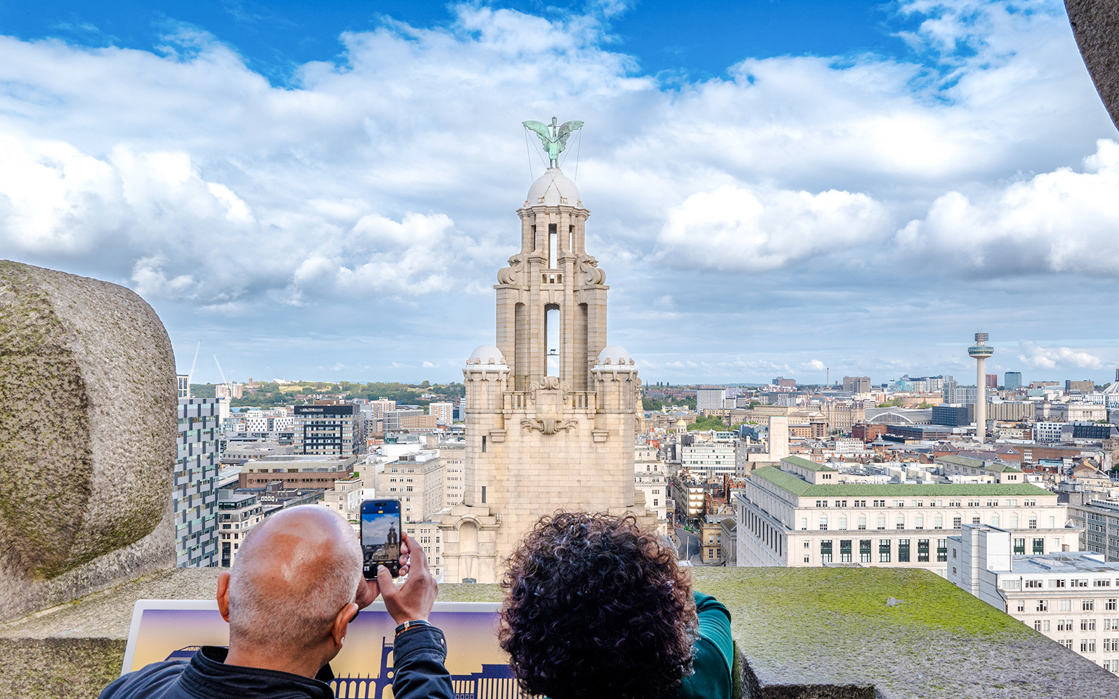 Guests photographing the Royal Liver Building in Liverpool.