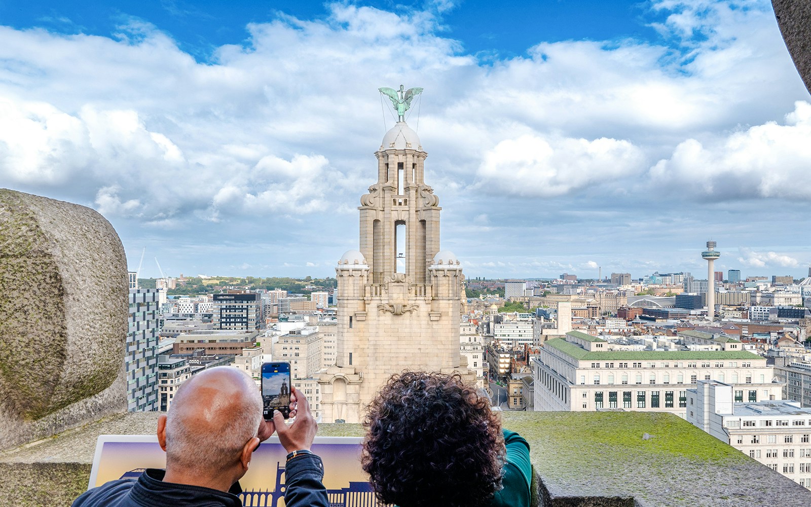 Guests photographing the Royal Liver Building in Liverpool.