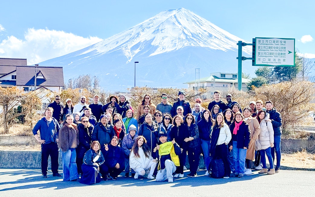 Tourists gathered in front of Mt. Fuji before boarding the Kachikachi Ropeway in Japan.