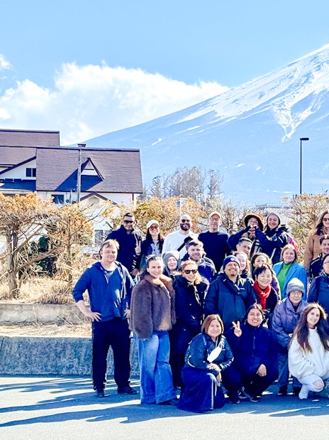 Tourists gathered in front of Mt. Fuji before boarding the Kachikachi Ropeway in Japan.
