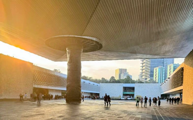 Visitors at the courtyard of the National Museum of Anthropology, Mexico City.