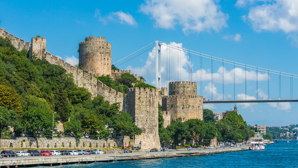 Rumeli Fortress along the Bosphorus with a bridge in Istanbul, Turkey.