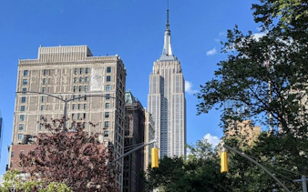 Flatiron Building and Empire State Building in New York City skyline.