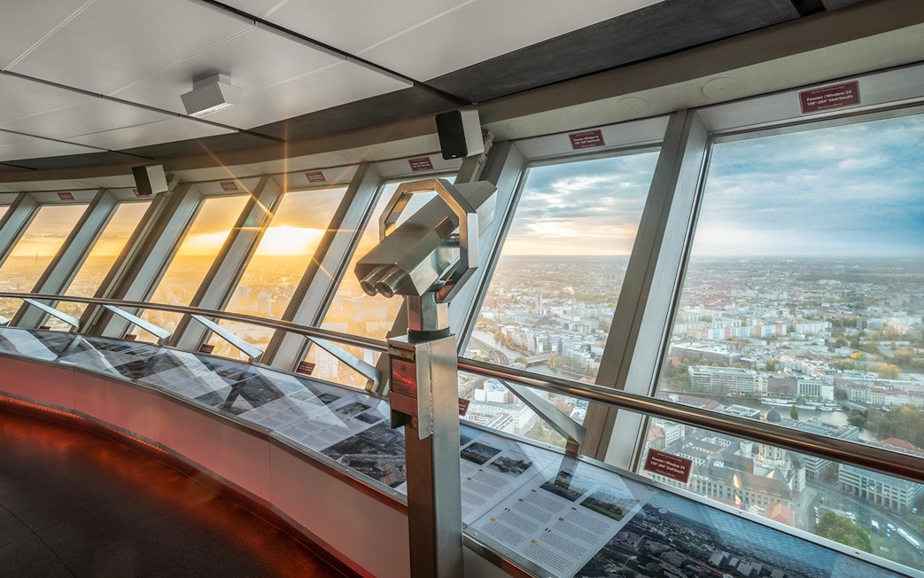 Binoculars on observation deck overlooking Berlin cityscape from TV Tower.
