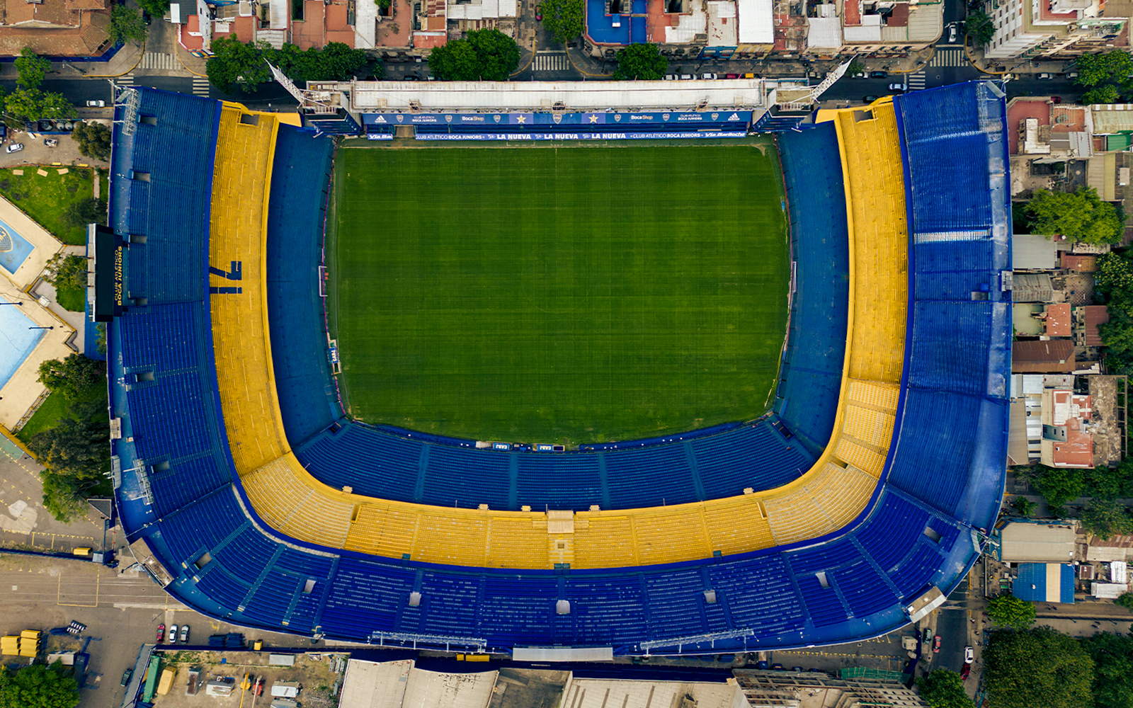 Aerial view of La Bombonera stadium in Buenos Aires, Argentina, showcasing its iconic horseshoe shape.