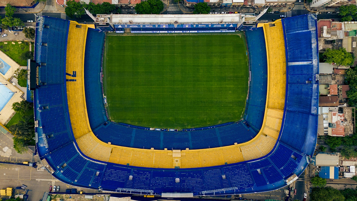 Aerial view of La Bombonera stadium in Buenos Aires, Argentina, showcasing its iconic horseshoe shape.