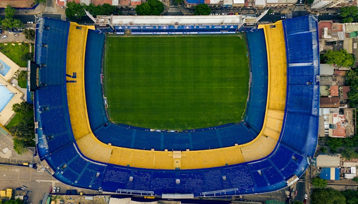 Aerial view of La Bombonera stadium in Buenos Aires, Argentina, showcasing its iconic horseshoe shape.
