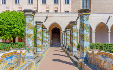 Colorful ceramic columns in the cloister of Santa Chiara, Naples.
