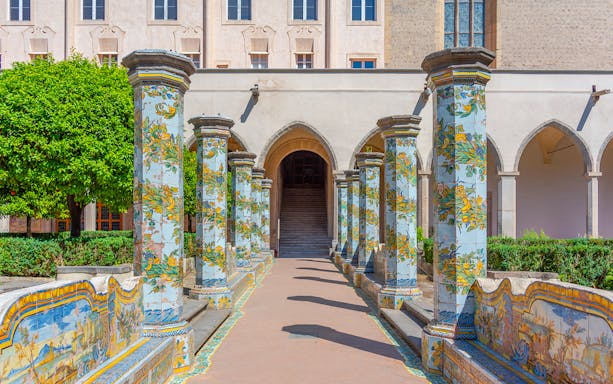 Colorful ceramic columns in the cloister of Santa Chiara, Naples.