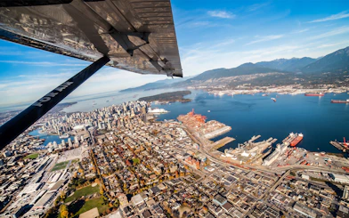 Aerial view of Vancouver cityscape and harbor from a seaplane tour.