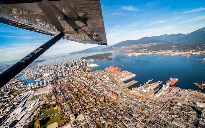 Aerial view of Vancouver cityscape and harbor from a seaplane tour.