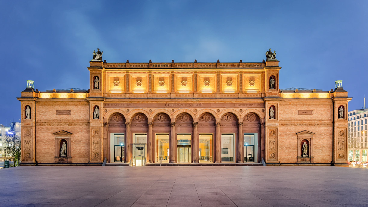 Kunsthalle Hamburg exterior with illuminated facade and statues, Germany.