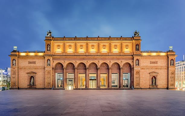 Kunsthalle Hamburg exterior with illuminated facade and statues, Germany.