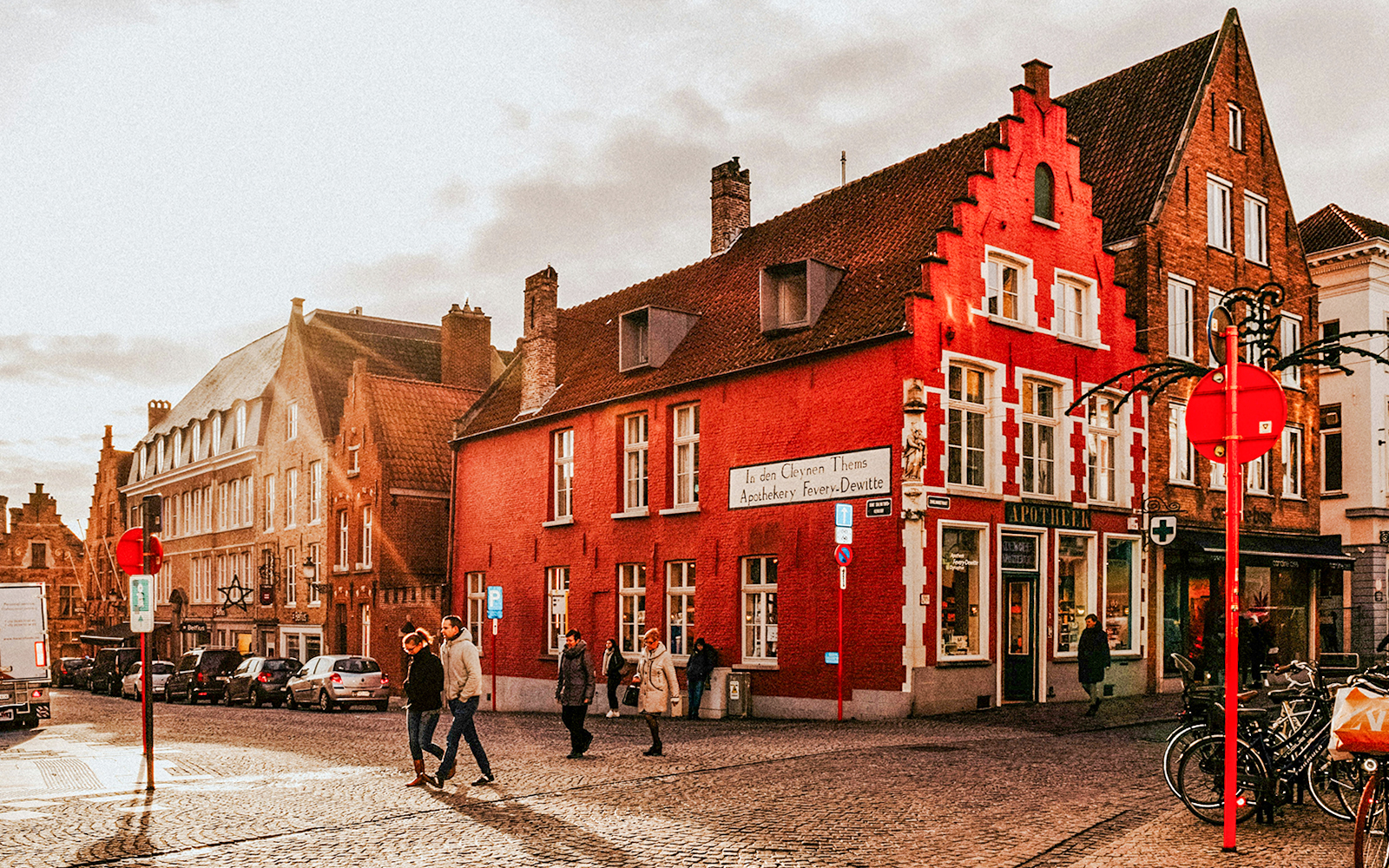 Historic buildings and pedestrians in the city center of Bruges, Belgium.