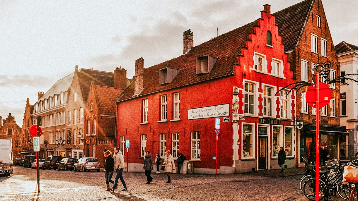 Historic buildings and pedestrians in the city center of Bruges, Belgium.