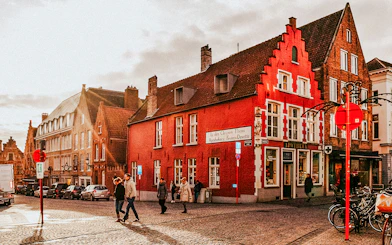 Historic buildings and pedestrians in the city center of Bruges, Belgium.