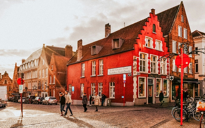 Historic buildings and pedestrians in the city center of Bruges, Belgium.