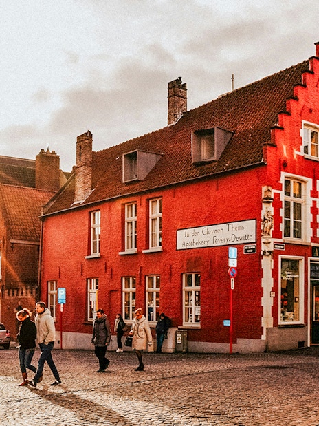 Historic buildings and pedestrians in the city center of Bruges, Belgium.