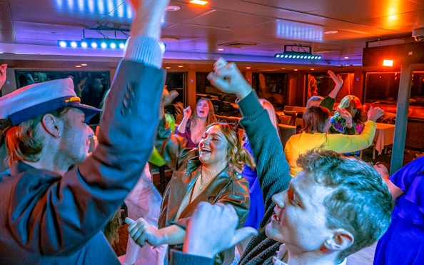 Guests dancing on Lake Michigan dinner cruise.