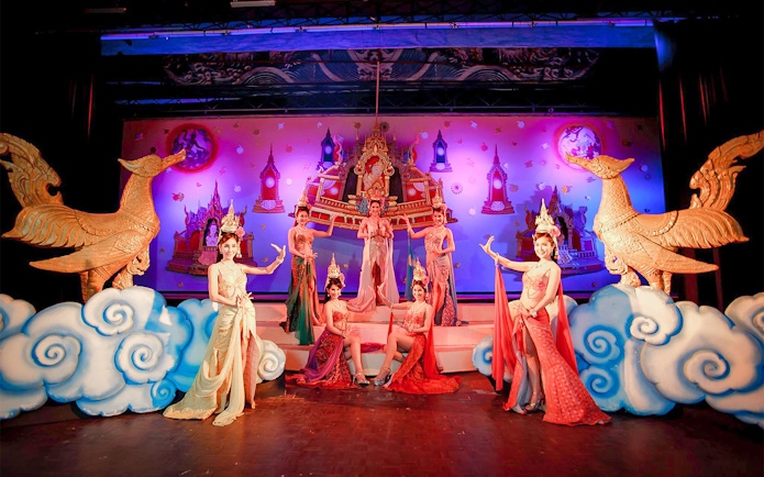Performers in traditional costumes on stage at the Golden Dome Cabaret Show, Bangkok.