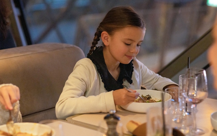 Child dining at Madame Brasserie, Eiffel Tower, Paris.