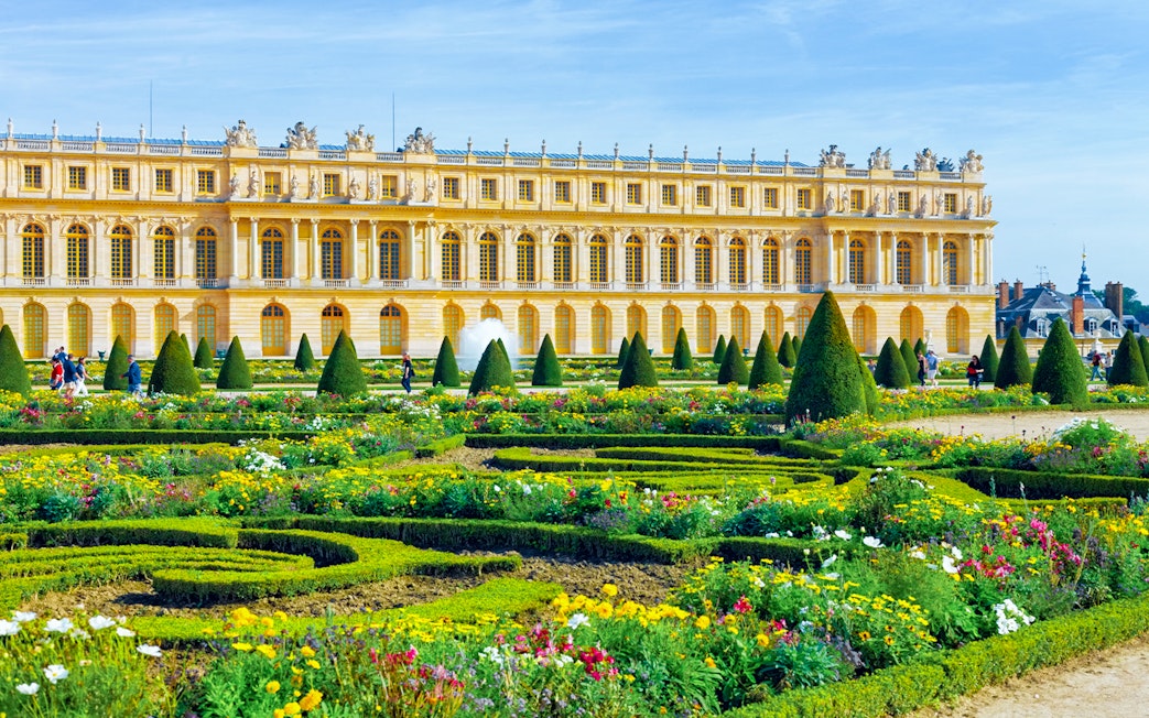 Gardens and pond in front of the Palace of Versailles near Paris.