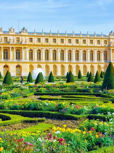 Gardens and pond in front of the Palace of Versailles near Paris.