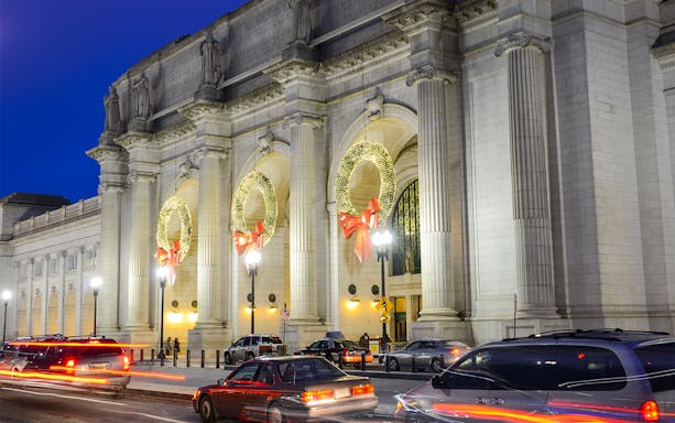 Union Station adorned with Christmas wreaths at night, Washington DC.