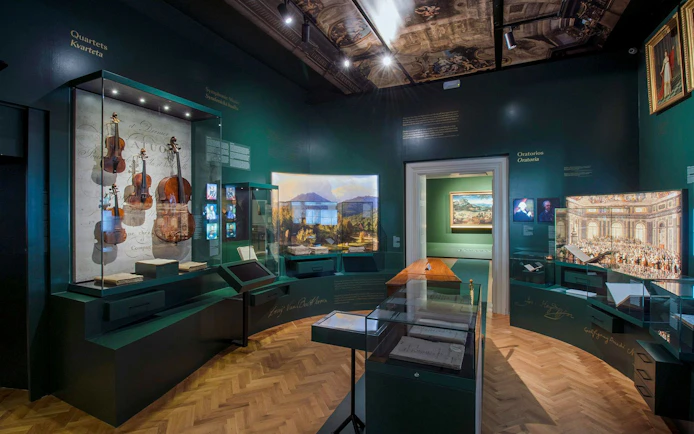 Exhibit of musical instruments and paintings at Lobkowicz Palace Museum, Prague.