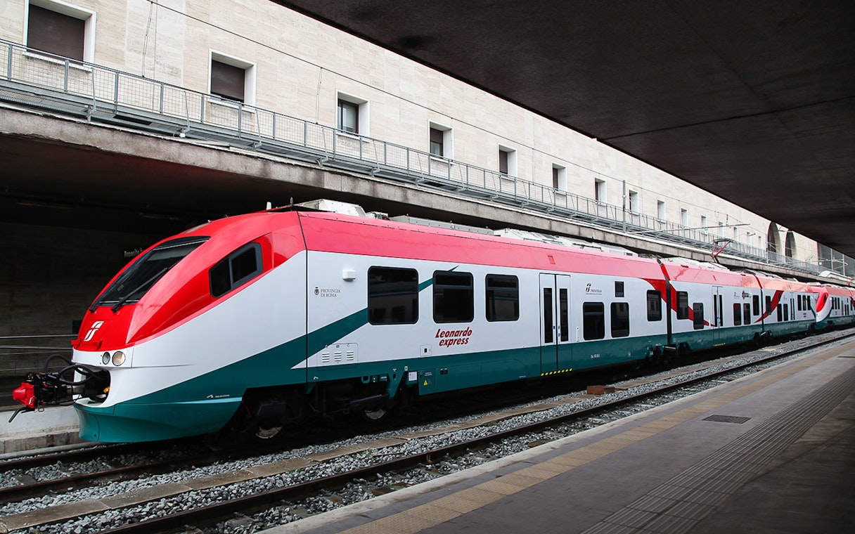 Leonardo Express train at station platform for Fiumicino Airport transfers.