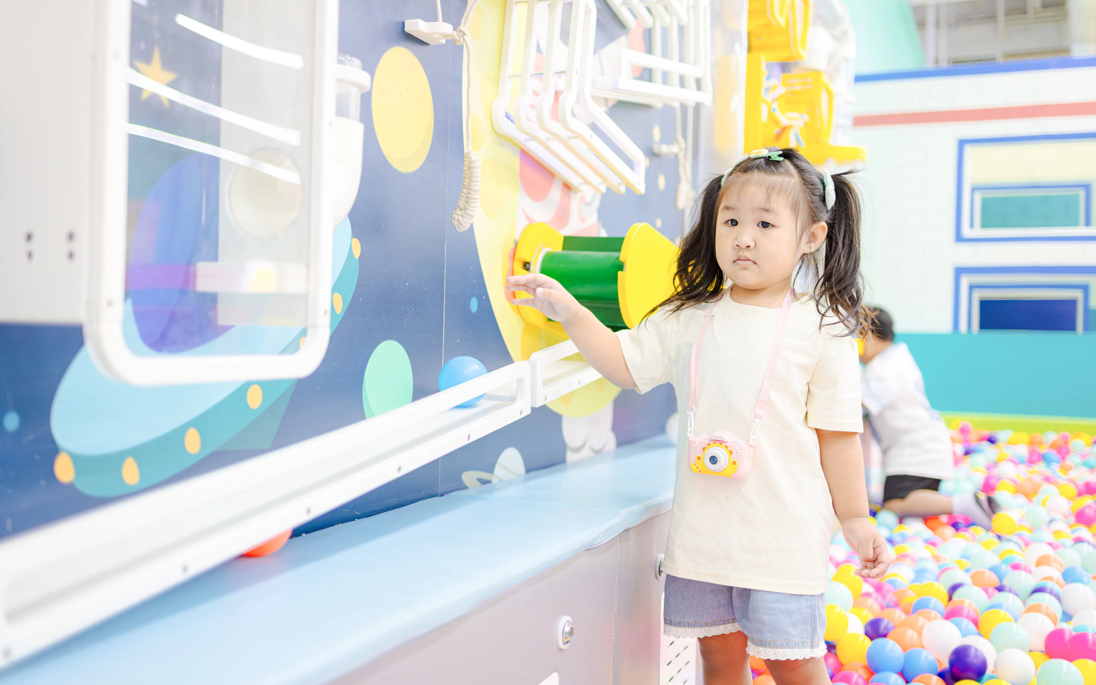 Child exploring interactive exhibit at Scienceworks science playground.
