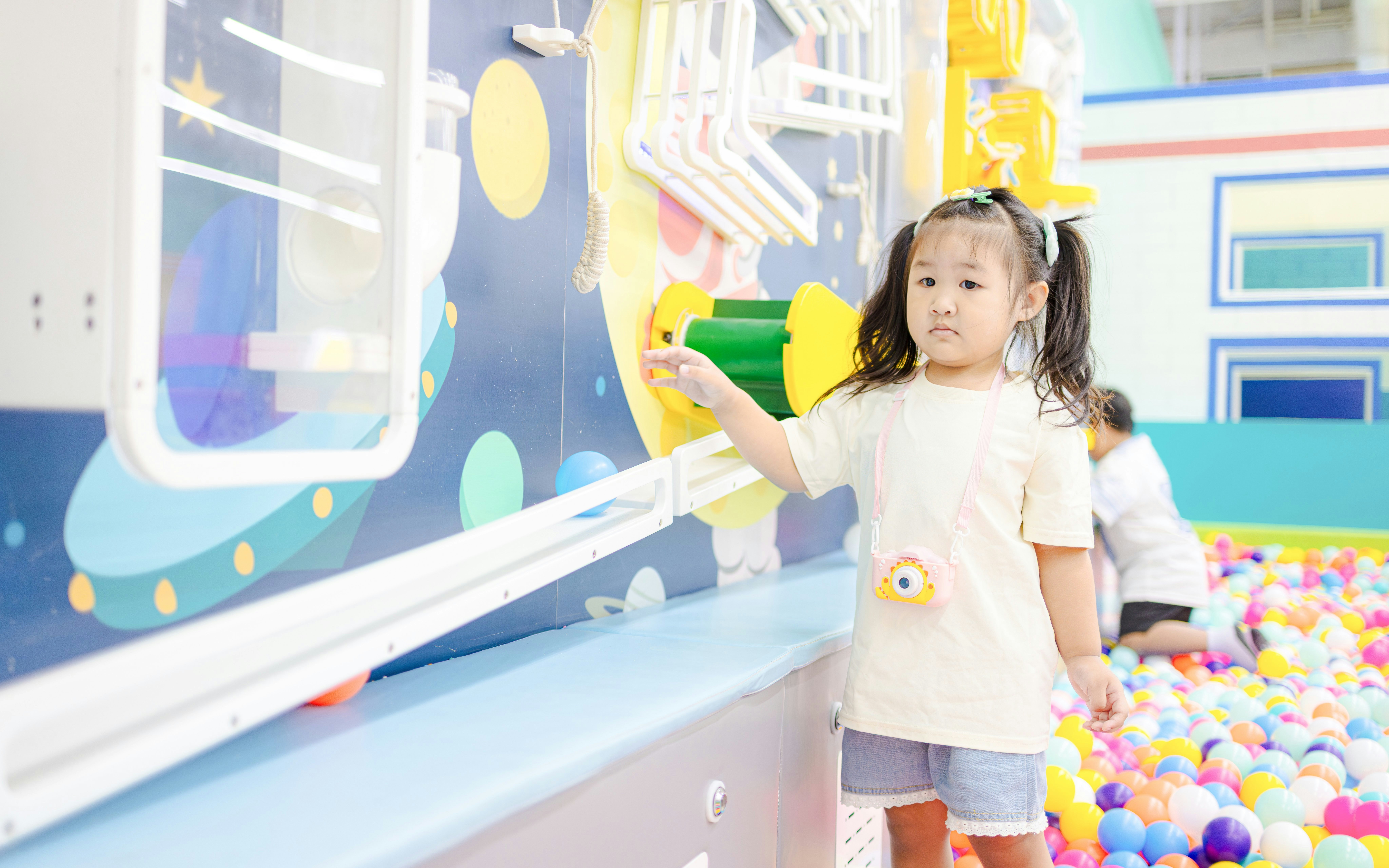 Child exploring interactive exhibit at Scienceworks science playground.