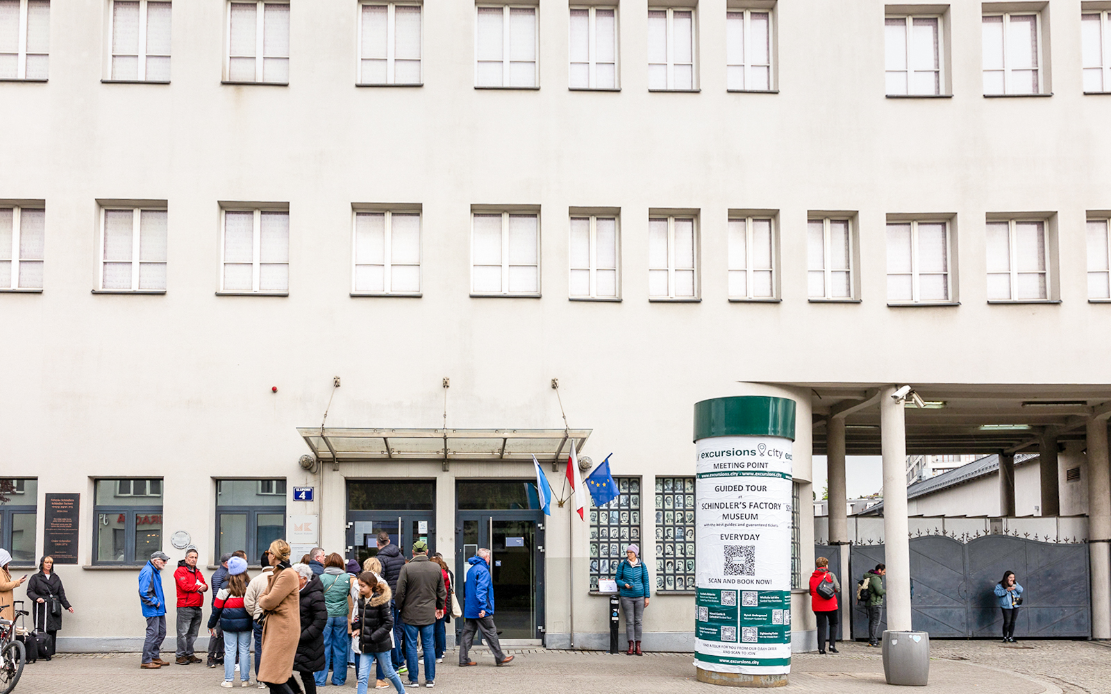 Oskar Schindler's Factory exterior with visitors in Krakow, Poland.