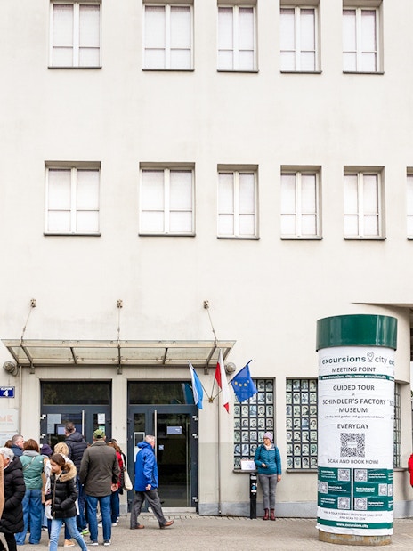 Oskar Schindler's Factory exterior with visitors in Krakow, Poland.