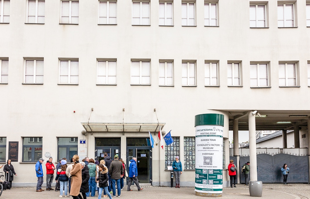 Oskar Schindler's Factory exterior with visitors in Krakow, Poland.