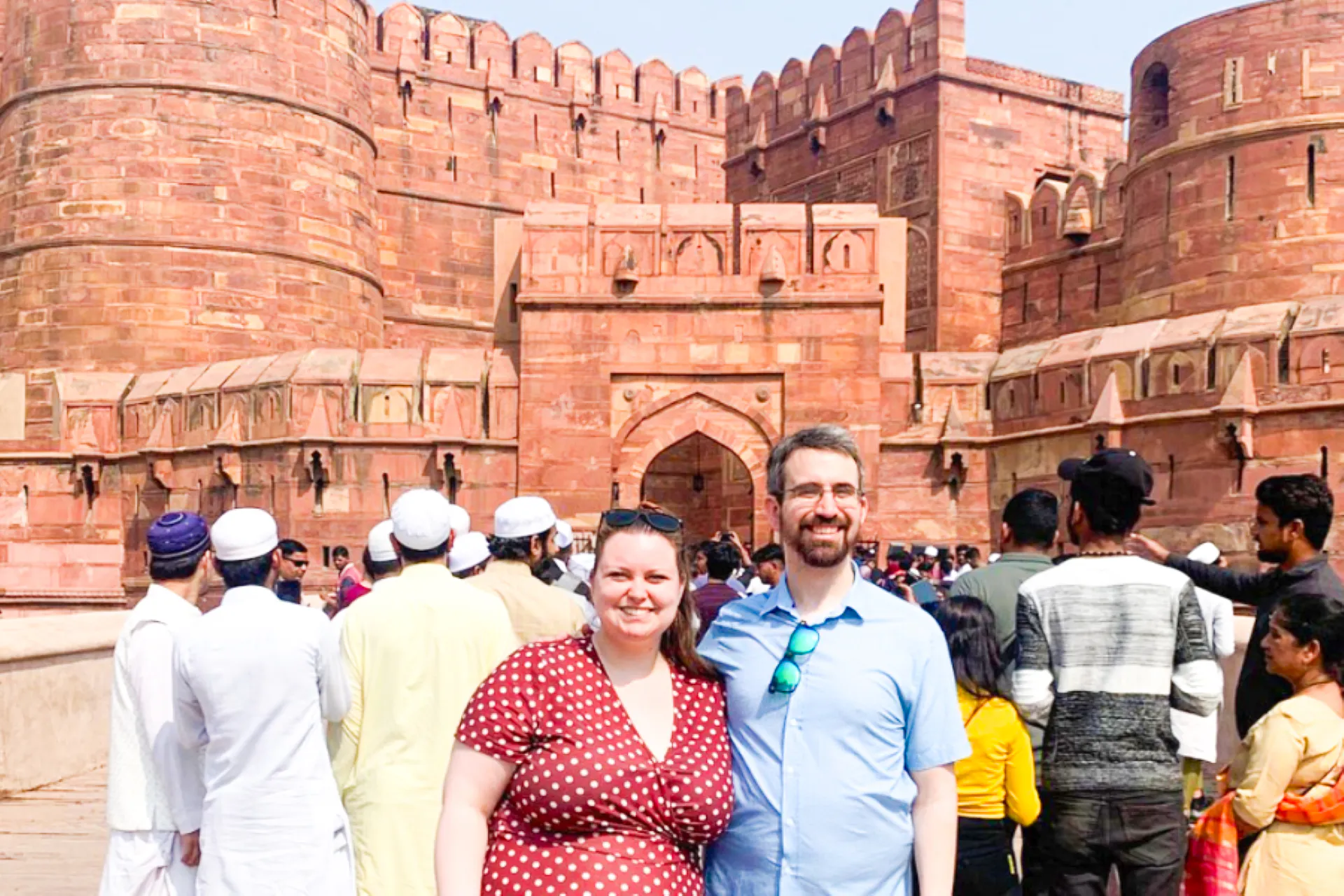 Visitors at Agra Fort entrance, part of the Sunrise Taj Mahal and Agra Fort tour from Delhi.