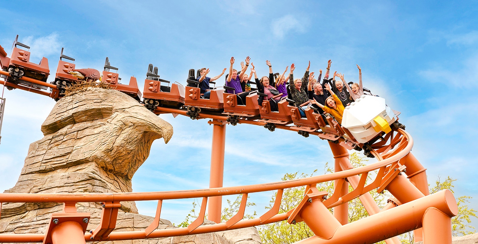 Rollercoaster at LEGOLAND® Billund with riders enjoying the thrill.