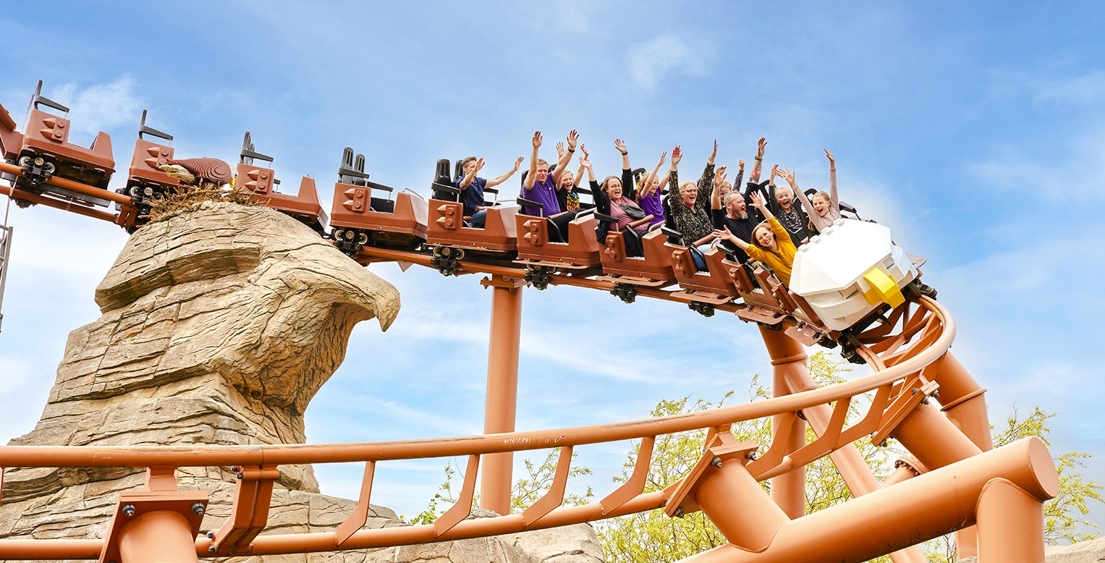 Rollercoaster at LEGOLAND® Billund with riders enjoying the thrill.