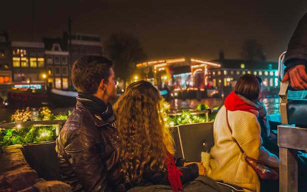Guests enjoying the illuminated cityscape on the German Guided Light Festival Cruise.