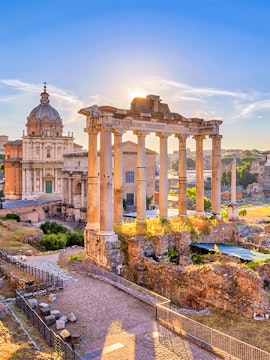 Roman Forum ruins with ancient columns and historic architecture in Rome, Italy.